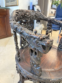 A pair of Chinese finely carved hongmu swivel chairs, Canton, 19th C.