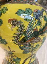 A pair of Chinese famille verte yellow-ground 'pheasants and peonies' vases and covers, 19th C.