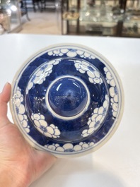 A pair of Chinese blue and white covered vases with floral design, 19th C.