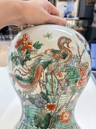 A Chinese famille verte 'phoenixes' vase and cover, 19th C.