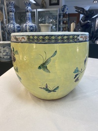 A Chinese famille rose yellow-ground 'pheasant and peony' scroll pot, 19th C.