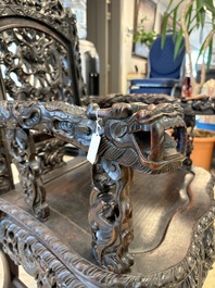 A pair of Chinese finely carved hongmu armchairs, Canton, 19th C.