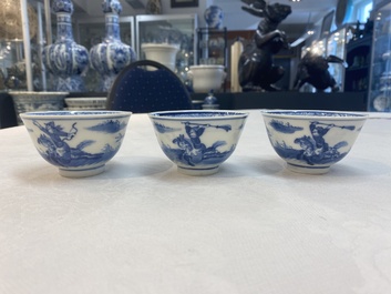 A set of 11 Chinese blue and white 'rabbit hunt' cups and saucers, Qianlong mark, 19th C.