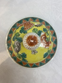 A pair of Chinese famille verte yellow-ground 'pheasants and peonies' vases and covers, 19th C.
