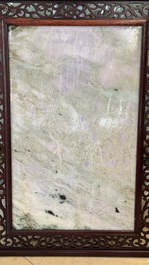 A Chinese lavender and green jadeite 'phoenix' plaque in a hongmu frame, early 20th C.