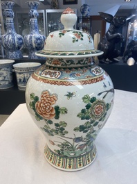 Two Chinese famille verte 'birds and flowers' vases and covers, 19th C.