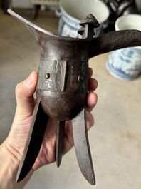 A Chinese archaic bronze wine vessel with taotie design, 'jue 爵', Zhou