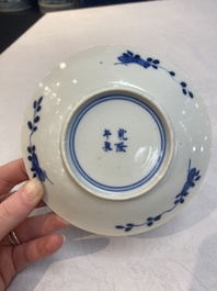 A set of 11 Chinese blue and white 'rabbit hunt' cups and saucers, Qianlong mark, 19th C.