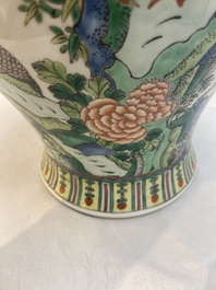 Two Chinese famille verte 'birds and flowers' vases and covers, 19th C.