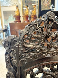 A pair of Chinese finely carved hongmu armchairs, Canton, 19th C.