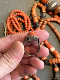 A varied group of five Tibetan necklaces, three rings and four earbobs with red coral, 19/20th C.