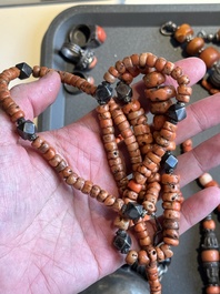 A varied group of five Tibetan necklaces, three rings and four earbobs with red coral, 19/20th C.