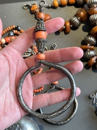 A varied group of five Tibetan necklaces, three rings and four earbobs with red coral, 19/20th C.