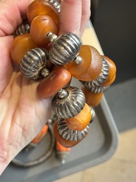 A varied group of five Tibetan necklaces, three rings and four earbobs with red coral, 19/20th C.