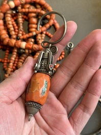 A varied group of five Tibetan necklaces, three rings and four earbobs with red coral, 19/20th C.