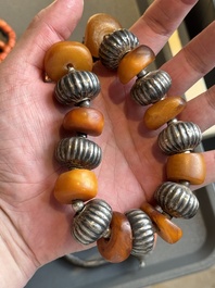 A varied group of five Tibetan necklaces, three rings and four earbobs with red coral, 19/20th C.