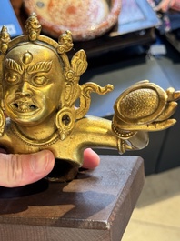 A Sino-Tibetan gilt-bronze Mahakala on stand, a Tibetan Vajradhaka and a Hayagriva, 19/20th C.