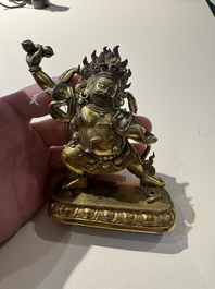 A Sino-Tibetan gilt-bronze Mahakala on stand, a Tibetan Vajradhaka and a Hayagriva, 19/20th C.