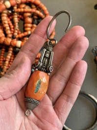 A varied group of five Tibetan necklaces, three rings and four earbobs with red coral, 19/20th C.