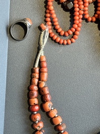 A varied group of five Tibetan necklaces, three rings and four earbobs with red coral, 19/20th C.