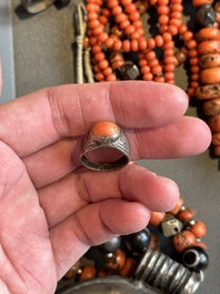 A varied group of five Tibetan necklaces, three rings and four earbobs with red coral, 19/20th C.