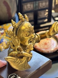 A Sino-Tibetan gilt-bronze Mahakala on stand, a Tibetan Vajradhaka and a Hayagriva, 19/20th C.
