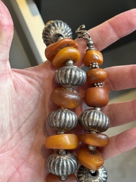 A varied group of five Tibetan necklaces, three rings and four earbobs with red coral, 19/20th C.