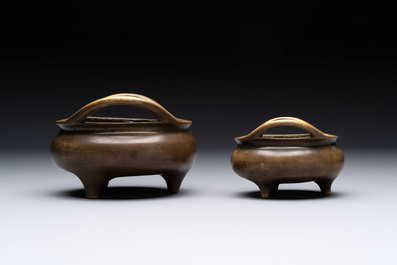 Two Chinese bronze tripod censers, Xuande marks, 19th C.