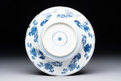 A Chinese blue and white lobed 'phoenix and monkey' plate, flower mark, Kangxi