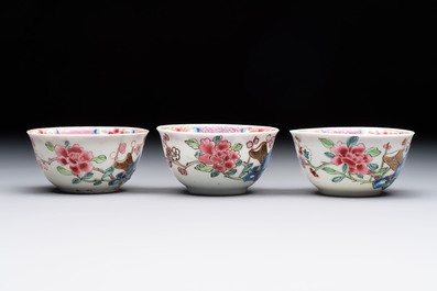 Eleven Chinese famille rose cups and nine saucers, Yongzheng/Qianlong