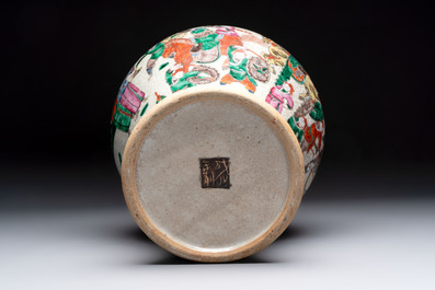Two Chinese Nanking famille verte covered vases and a famille rose vase, 19th C.