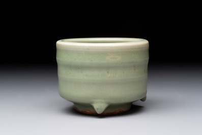 A small Chinese Longquan celadon cylindrical tripod censer, Ming