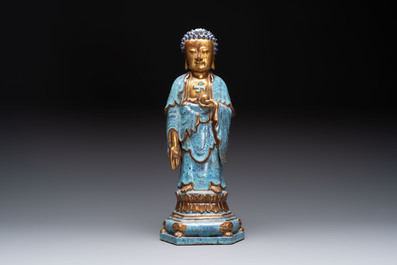 A Chinese robin's egg-glazed gilt-decorated standing Buddha, 18th C.