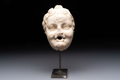 A marble 'putto head' fountain spout, France or Italy, 19th C. or earlier