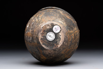 A rare Chinese parcel-gilt silver handled jar with floral scroll design, Tang