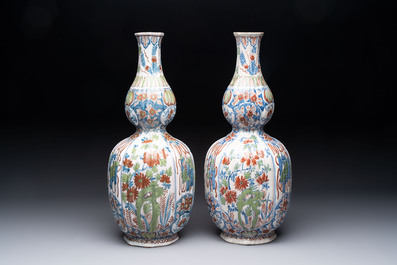 A pair of polychrome Dutch Delft double gourd vases, 19th C.