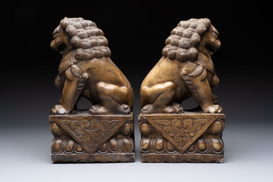 A pair of Chinese carved stone Buddhist lions, a large seal and a wooden box with four seals, 20th C.