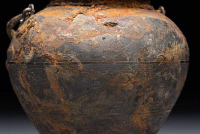 A rare Chinese parcel-gilt silver handled jar with floral scroll design, Tang