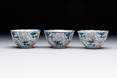 Eleven Chinese famille rose cups and nine saucers, Yongzheng/Qianlong