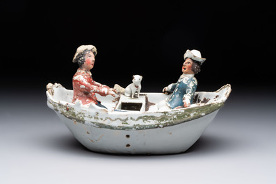 A cold-painted white Dutch Delft 'rowing boat' group, 18th C.