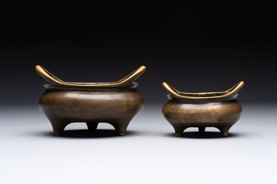 Two Chinese bronze tripod censers, Xuande marks, 19th C.