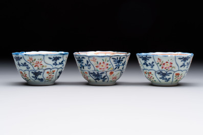 Eleven Chinese famille rose cups and nine saucers, Yongzheng/Qianlong
