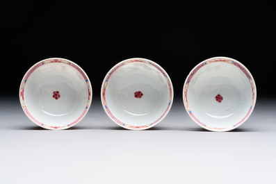 Eleven Chinese famille rose cups and nine saucers, Yongzheng/Qianlong
