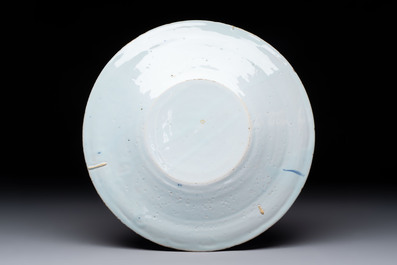 A blue and white Dutch Delft chinoiserie plate, 17th C.