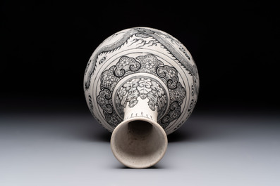 A Chinese black-enamelled biscuit 'dragon' vase, Kangxi mark, 19th C.