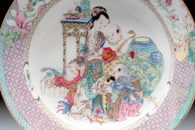A fine Chinese famille rose ruby-back eggshell plate with a lady and playing boys, Yongzheng