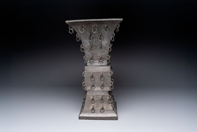 A large Chinese bronze quadrangular 'gu' vase with hanging rings, Ming