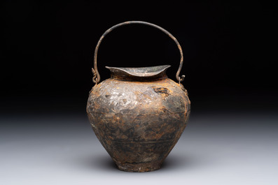 A rare Chinese parcel-gilt silver handled jar with floral scroll design, Tang