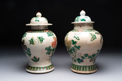 Two Chinese Nanking famille verte covered vases and a famille rose vase, 19th C.