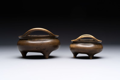 Two Chinese bronze tripod censers, Xuande marks, 19th C.